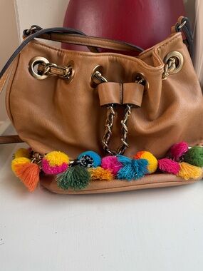 ALDO Boho Tan  Faux Leather shoulder Bag with colorful Pom Pom Tassels.